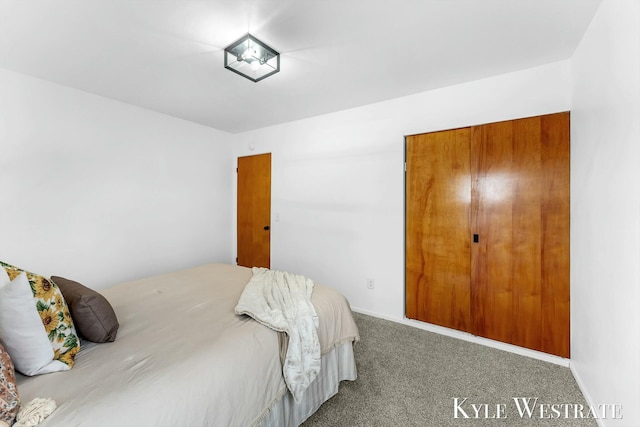 carpeted bedroom with baseboards