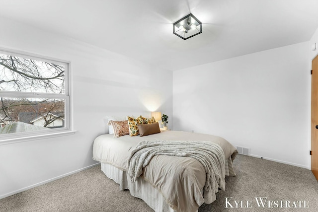 bedroom featuring visible vents, baseboards, and carpet flooring