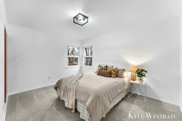 bedroom with carpet floors and baseboards