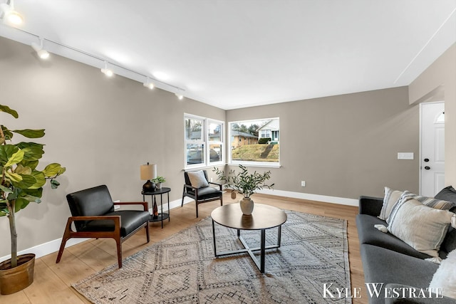 living room with wood finished floors and baseboards