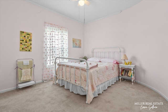 bedroom with baseboards, ornamental molding, and carpet flooring