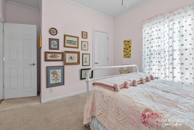 carpeted bedroom featuring ornamental molding and baseboards