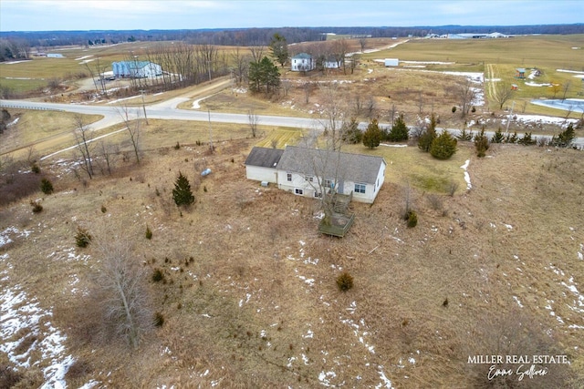 birds eye view of property featuring a rural view