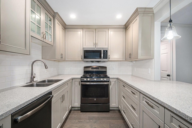 kitchen with stainless steel appliances, backsplash, glass insert cabinets, dark wood-type flooring, and a sink