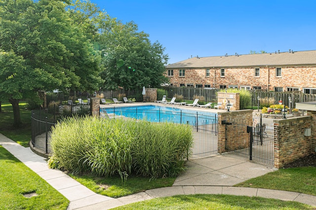 pool featuring a patio area and fence