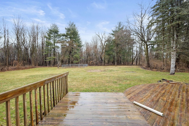 wooden terrace with a lawn