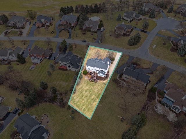 birds eye view of property with a residential view