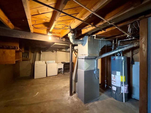 unfinished below grade area with separate washer and dryer and gas water heater