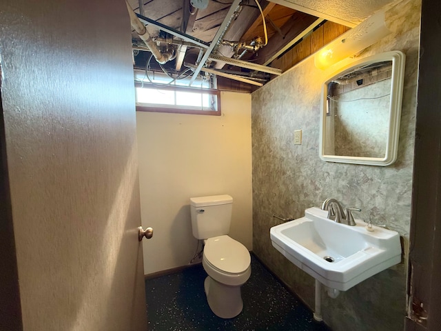 half bathroom with a sink and toilet