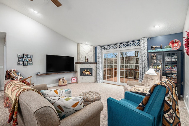 carpeted living area with ceiling fan, a fireplace, baseboards, and recessed lighting