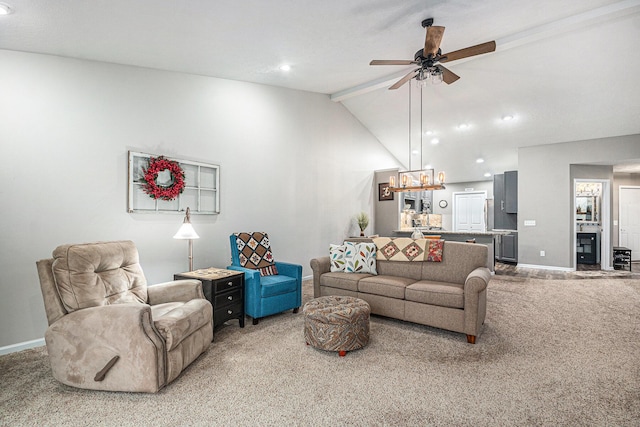 living area with carpet floors, a ceiling fan, baseboards, and beamed ceiling