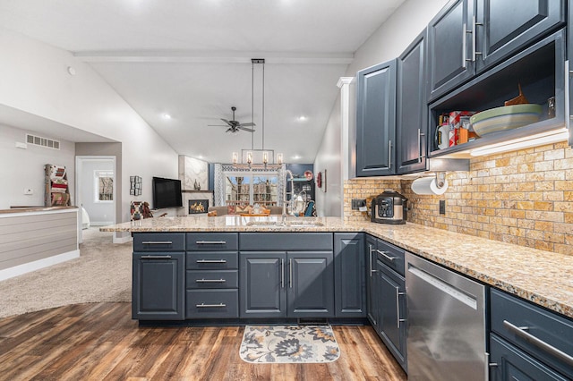 kitchen featuring vaulted ceiling with beams, a peninsula, a sink, open floor plan, and stainless steel dishwasher