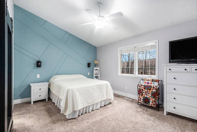 bedroom featuring carpet flooring, ceiling fan, visible vents, and baseboards