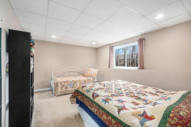 bedroom with carpet, baseboards, a drop ceiling, and recessed lighting