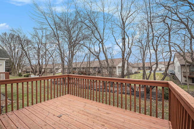 deck with a lawn and a residential view