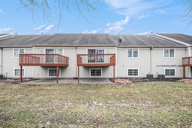 back of house with a shingled roof, central AC, a yard, and a deck