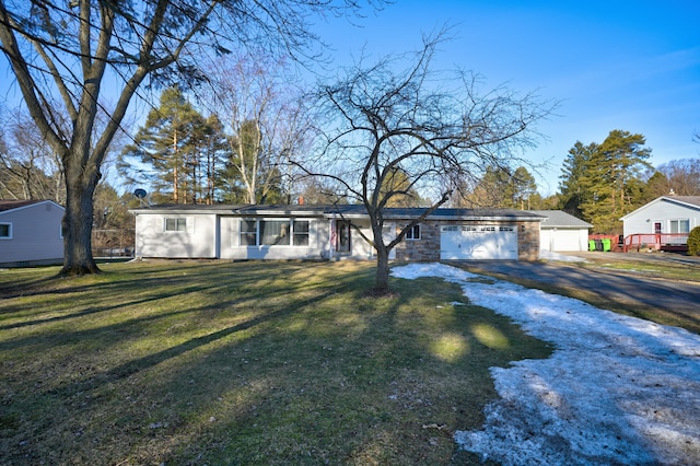 view of front facade with a front yard and an attached garage