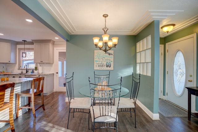 dining area with recessed lighting, baseboards, dark wood-style flooring, and a chandelier