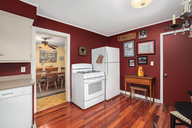 kitchen with white appliances, ceiling fan, parquet floors, light countertops, and crown molding