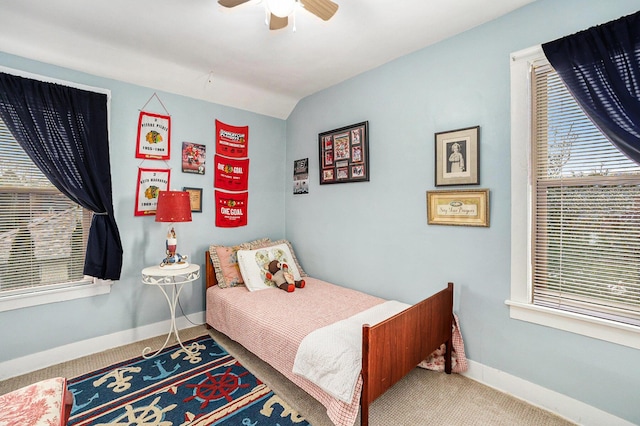 bedroom with carpet floors, a ceiling fan, and baseboards