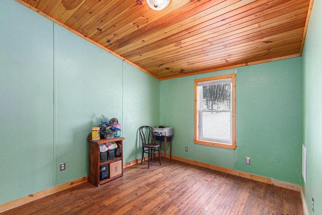 interior space with hardwood / wood-style floors, wood ceiling, and baseboards