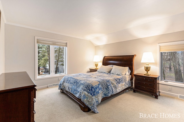 carpeted bedroom featuring lofted ceiling, visible vents, and baseboards