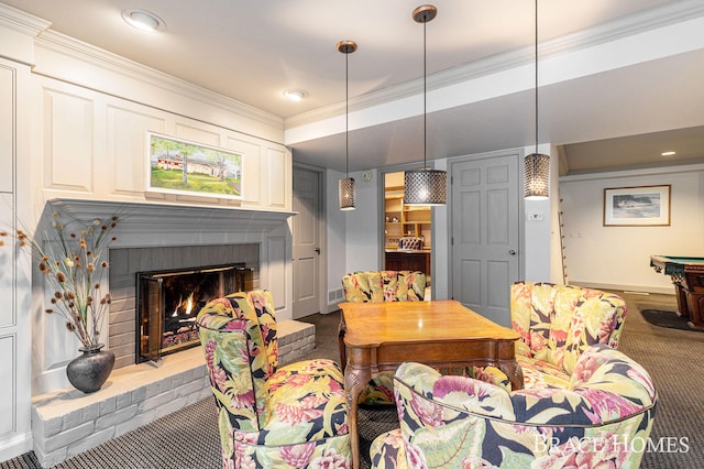 carpeted living room featuring ornamental molding and a fireplace