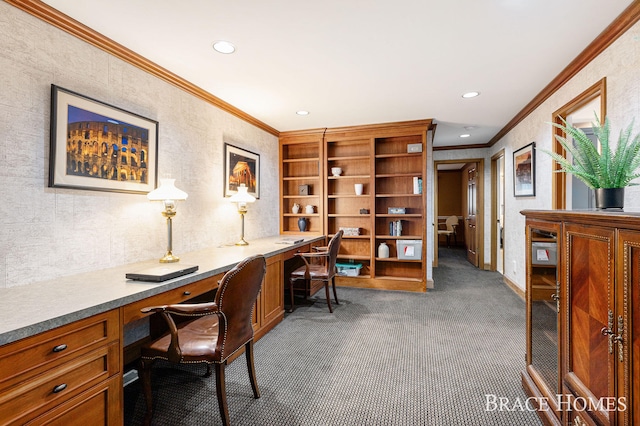 carpeted office space featuring ornamental molding, recessed lighting, built in study area, and baseboards