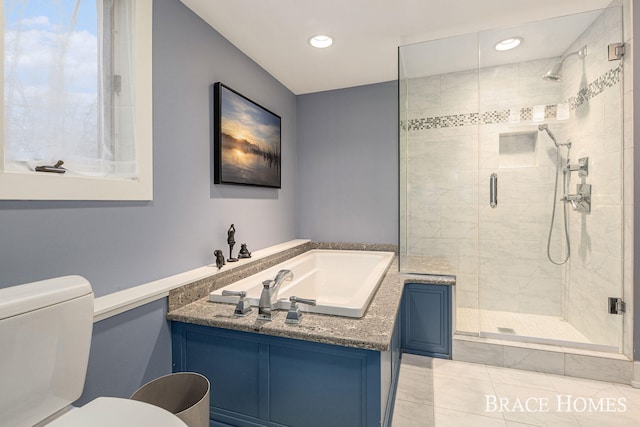 bathroom featuring tile patterned floors, a shower stall, toilet, and recessed lighting