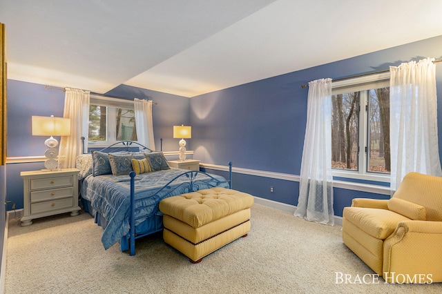 bedroom featuring carpet flooring and baseboards