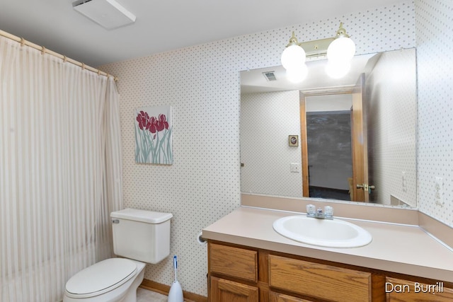 bathroom featuring toilet, wallpapered walls, visible vents, and vanity