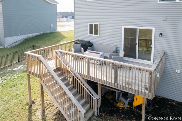 deck with a yard, fence, stairway, and area for grilling