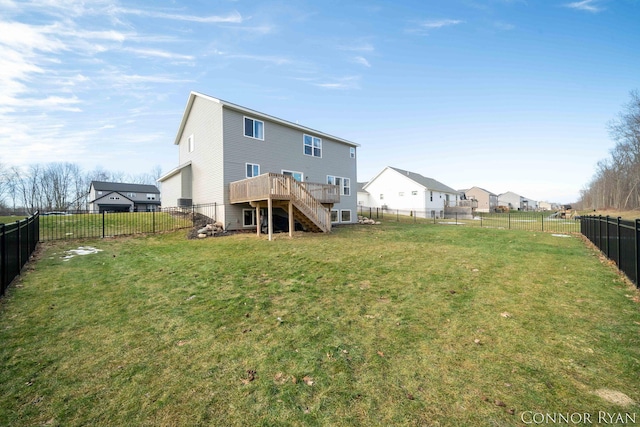 back of house featuring a yard, stairway, a fenced backyard, and a wooden deck