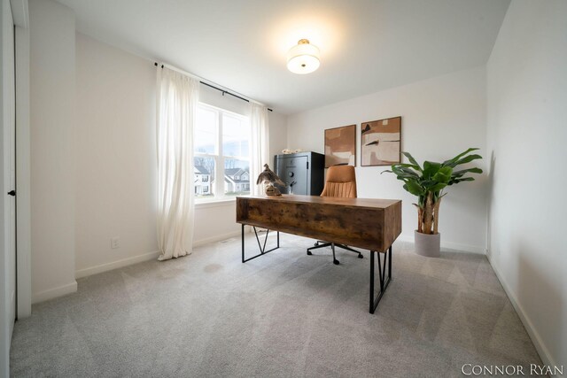 office space with carpet flooring and baseboards