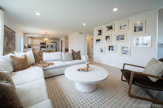 living room with visible vents and recessed lighting