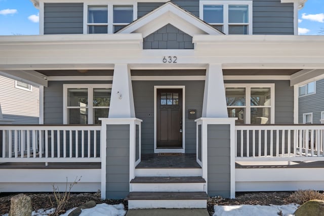 property entrance with covered porch