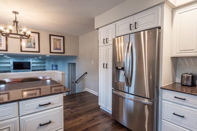 kitchen featuring dark wood-type flooring, decorative backsplash, white cabinetry, and stainless steel fridge with ice dispenser