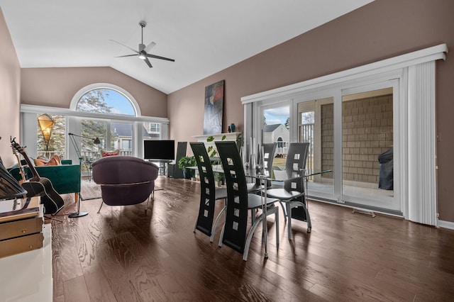 dining space featuring vaulted ceiling, visible vents, wood finished floors, and a ceiling fan