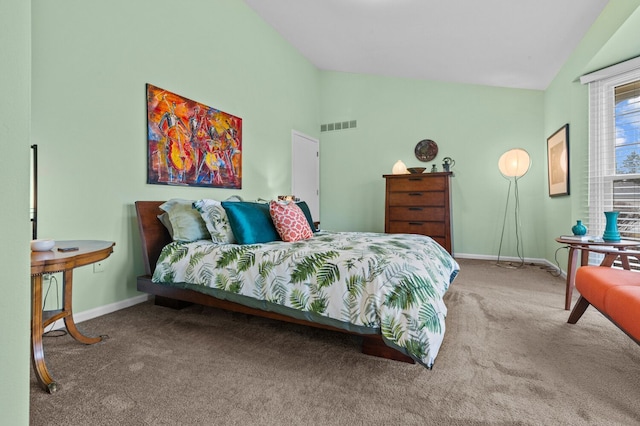 carpeted bedroom featuring high vaulted ceiling, visible vents, and baseboards