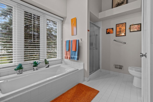 full bath with visible vents, toilet, tile patterned flooring, a shower stall, and a bath