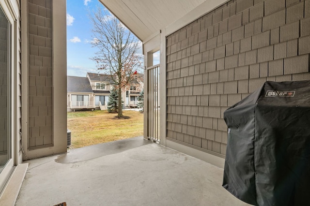 view of patio / terrace featuring a grill and central air condition unit