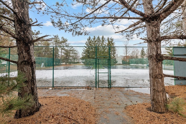 view of gate with fence