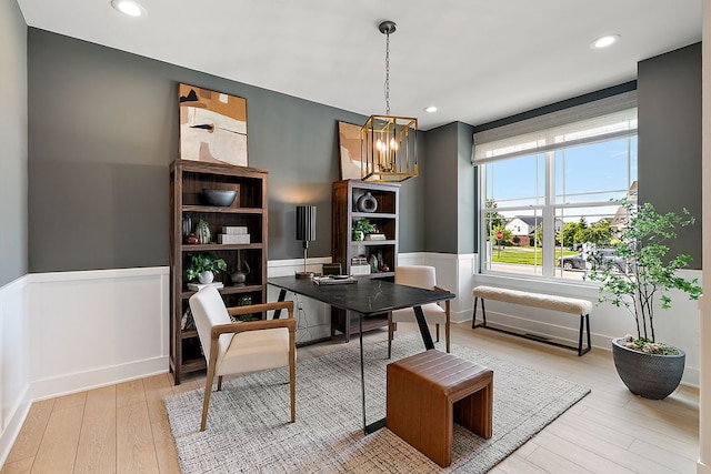 dining room featuring a wainscoted wall, wood finished floors, and recessed lighting