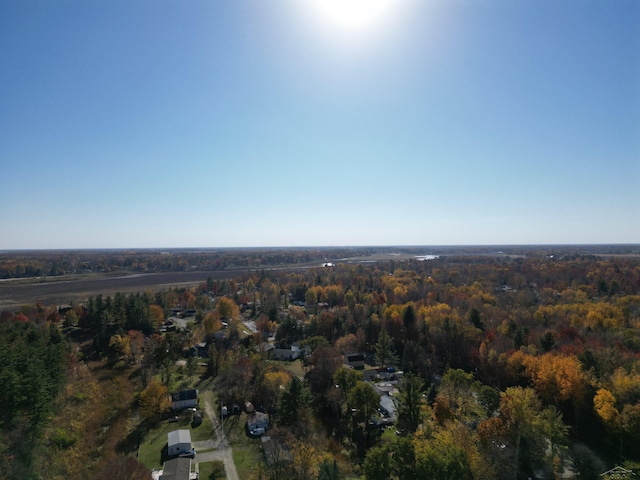 bird's eye view featuring a wooded view