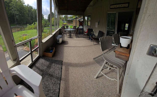 sunroom with lofted ceiling