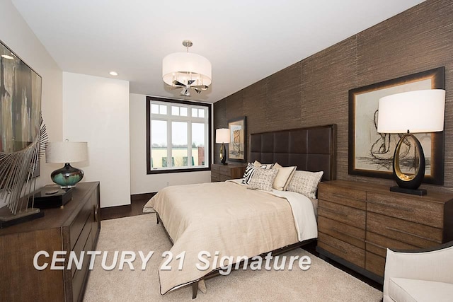 bedroom featuring a chandelier and recessed lighting