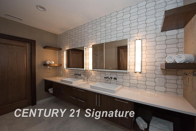 110 E Main St, Midland, MI 48640 - full bathroom with backsplash and double vanity
