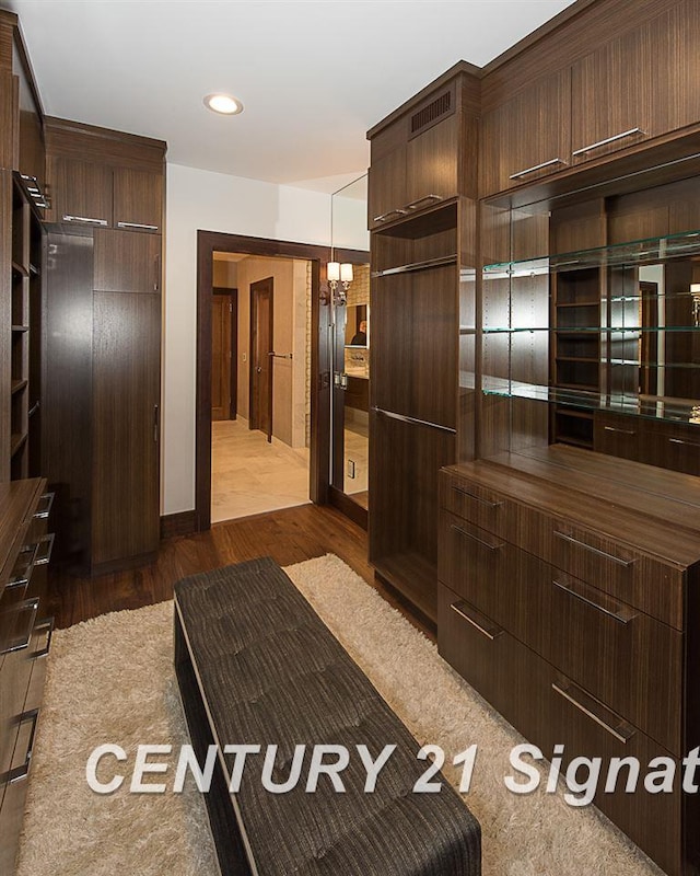 interior space featuring visible vents, wood finished floors, and recessed lighting