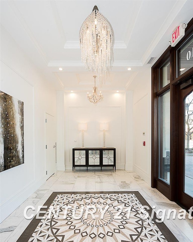 foyer with visible vents, ornamental molding, marble finish floor, a chandelier, and recessed lighting