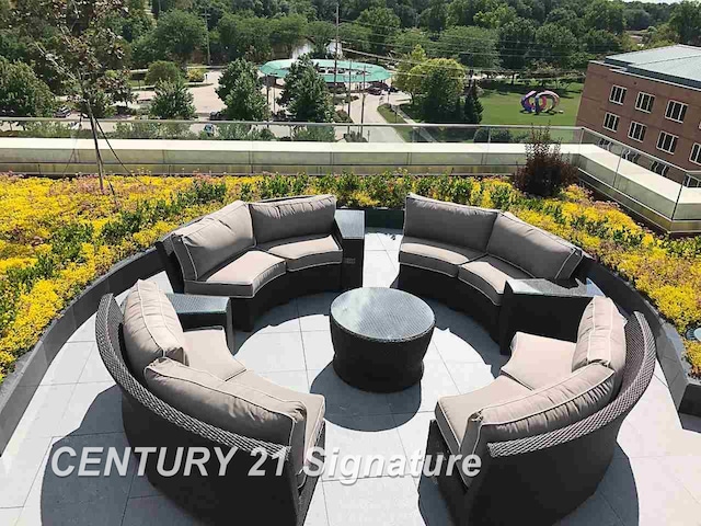 view of patio featuring a balcony and outdoor lounge area